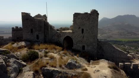 Turkey-Castles:-Aerial-Majesty:-Yilan-Castle's-Grandeur,-Majestic-Castle:-Aerial-View-from-Steep-Hill