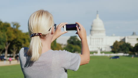 woman photographs capitol building dc