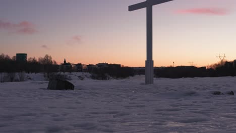 wooden cross against a beautiful sky