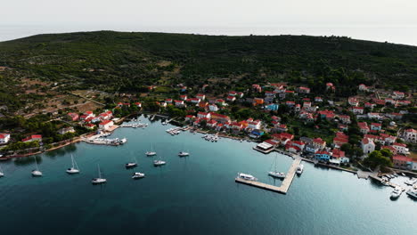Cinematic-aerial-establishing-shot-of-Ilovik-island-Croatia-and-stunning-coastline