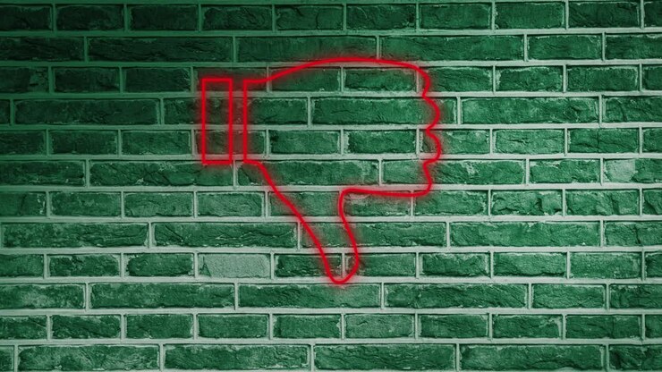 Animation of glowing neon thumbs down icon on brick wall