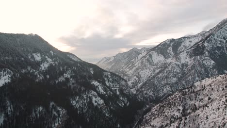 american fork canyon with snow during winter sunset, aerial with copy space