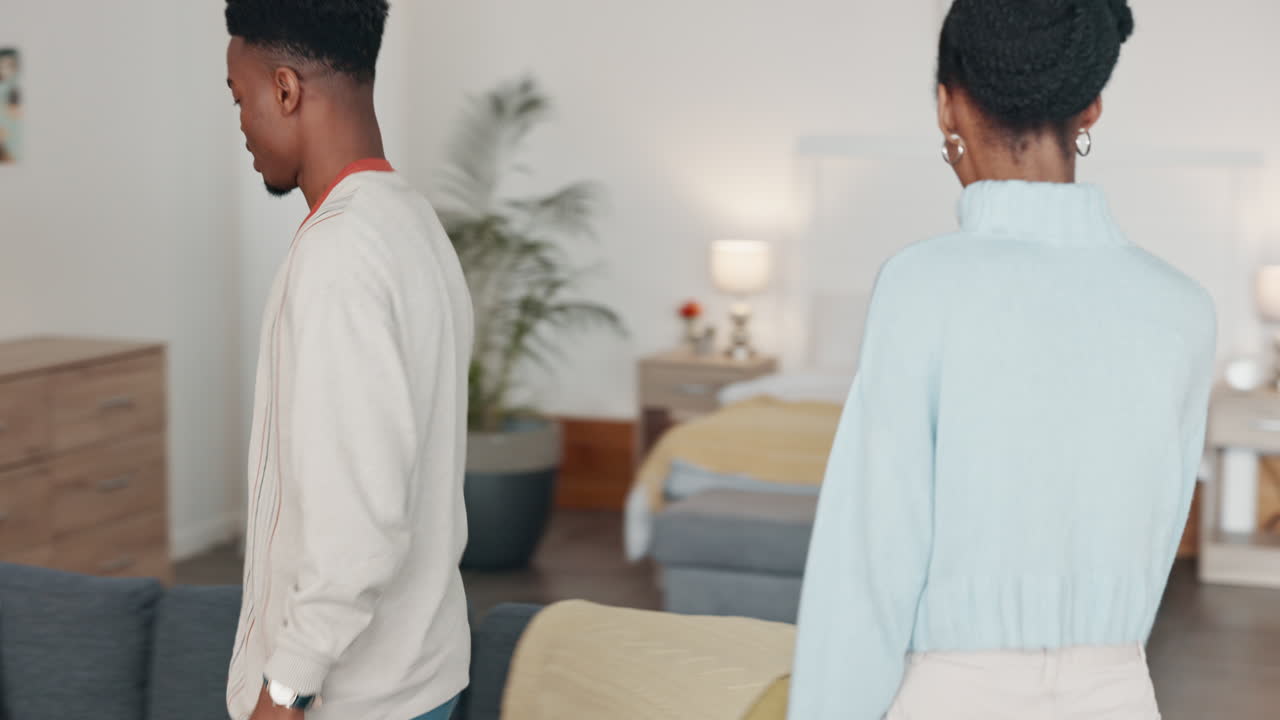 Black couple, relax and love on sofa in living