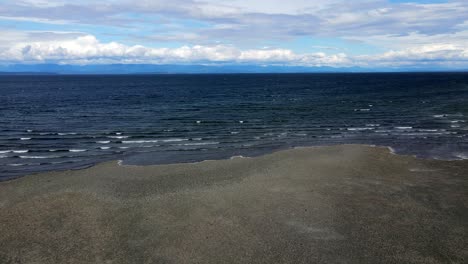 Sideways-moving-aerial-shot-of-Ocean-shoreline-on-Vancouver-Island,-Canada