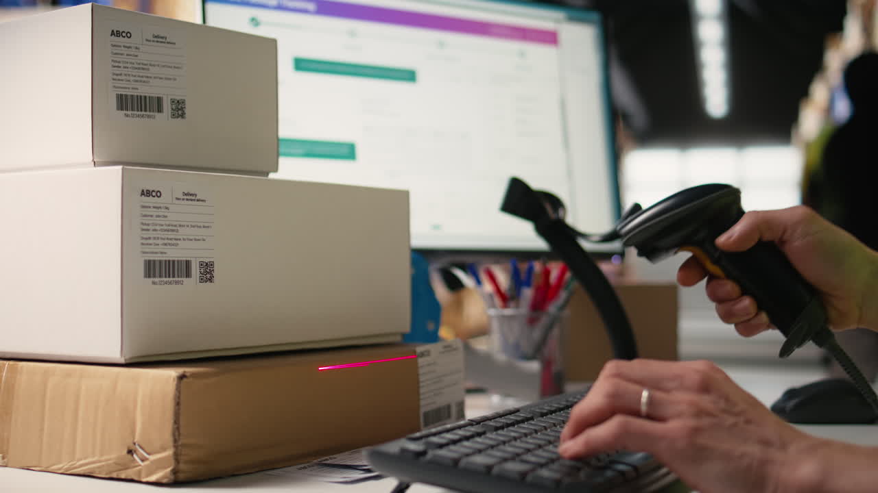 Vertical Video Logistics hub worker uses scanner on tracking info tags for express delivery