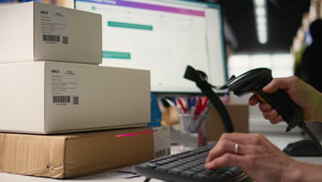 vertical video logistics hub worker uses scanner on tracking info tags for express delivery