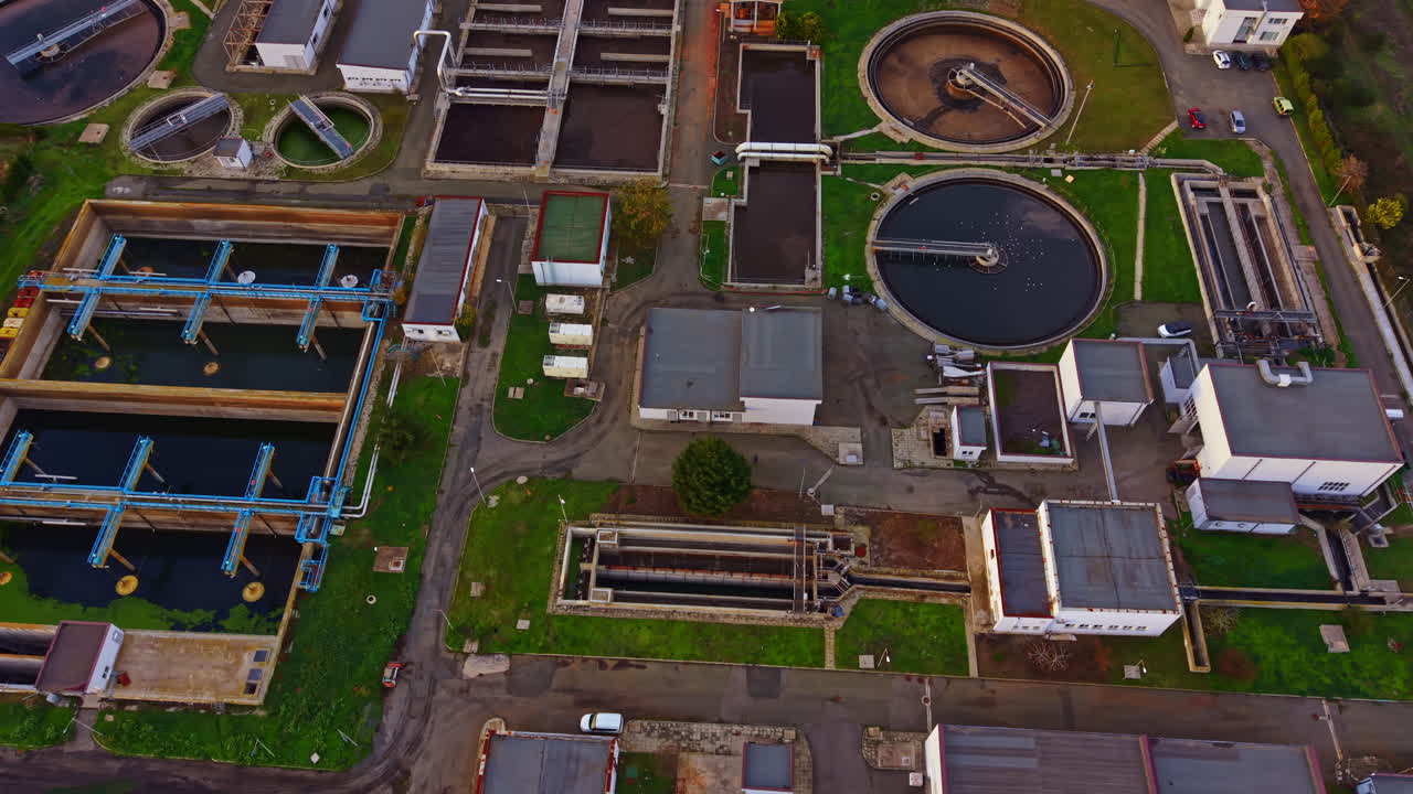 Overview of a modern wastewater treatment plant showing various filtration and processing units in clean, organized layout