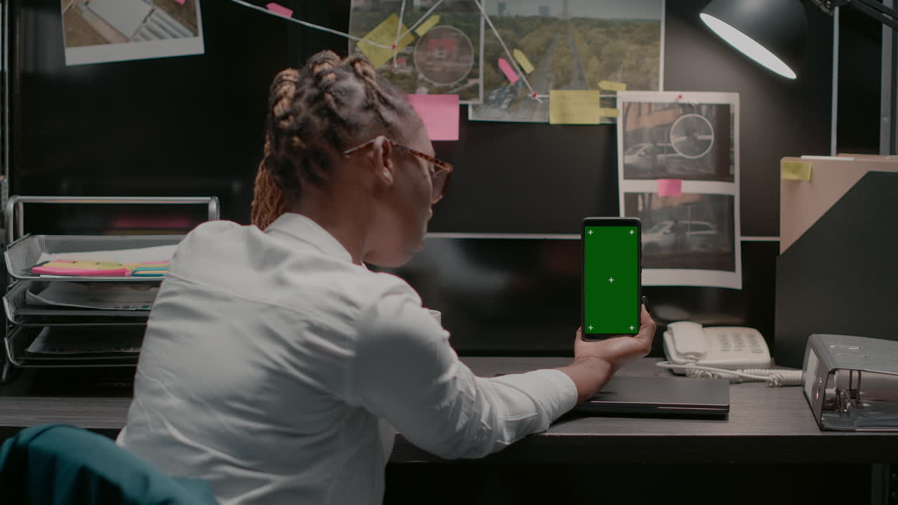 Detective working in her office