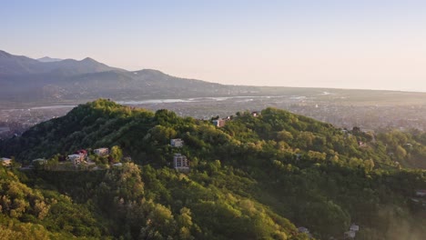 sunset landscape of blooming hills and valleys against river delta and black sea expanse