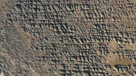 vertical descending view of a low tide boulder field, hunstanton, uk