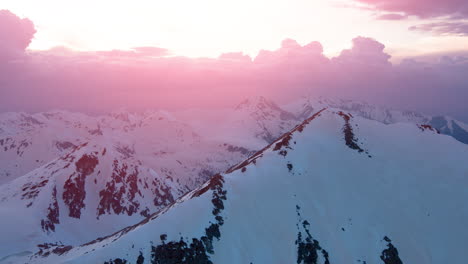 pink sunset over snow-capped mountains