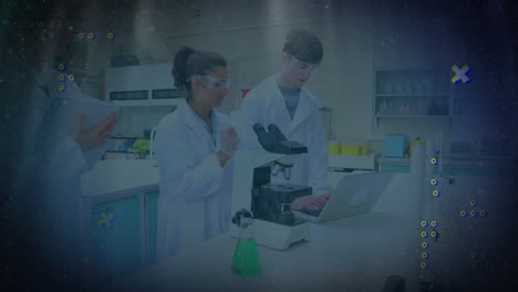 lab researchers collaborating around microscope and laptop in tech lab, displaying animated graphs