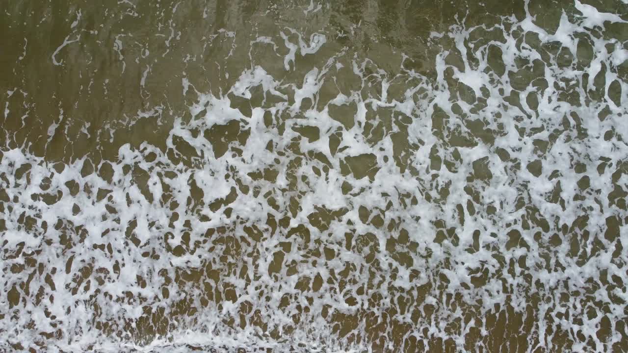 Fast Moving Sideways Aerial Drone of Sea Waves Crashing onto Mewslade Bay UK 4K