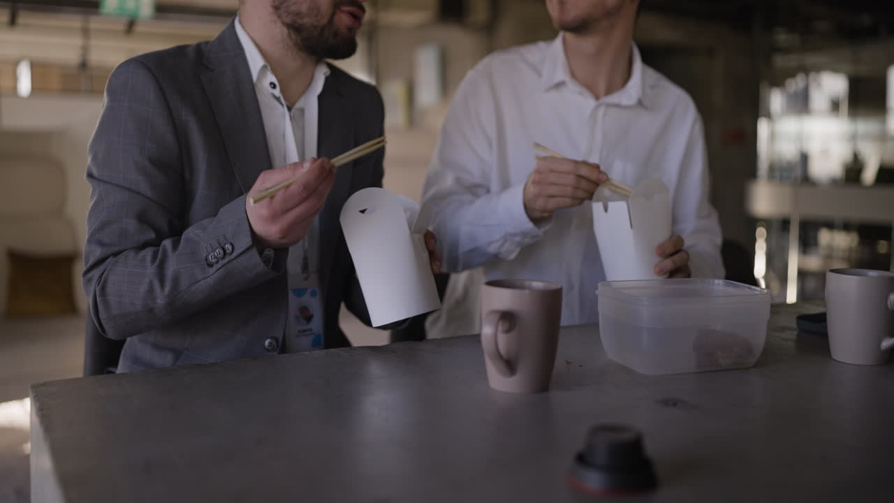 Businessmen eating lunch in an office