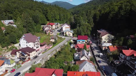 Aerial-view-of-Carpathian-mountaineer-villas-resort,-pine-forest-in-the-background