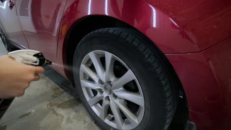 washing the car. cleaning aluminum wheels. car wash.