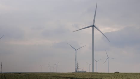 Wind-Turbines-On-The-Green-Field-On-A-Cloudy-Day---static-shot