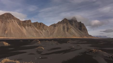 vestrahorn, eystrahorn, and brunnhorn mountains aerial view over stokksnes' black sand beaches, iceland's coastal beauty.
