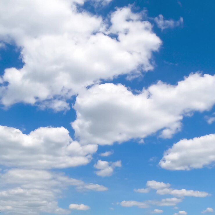 Constantly transforming white cotton clouds in the blue sky. Cumulus clouds building timelapse
