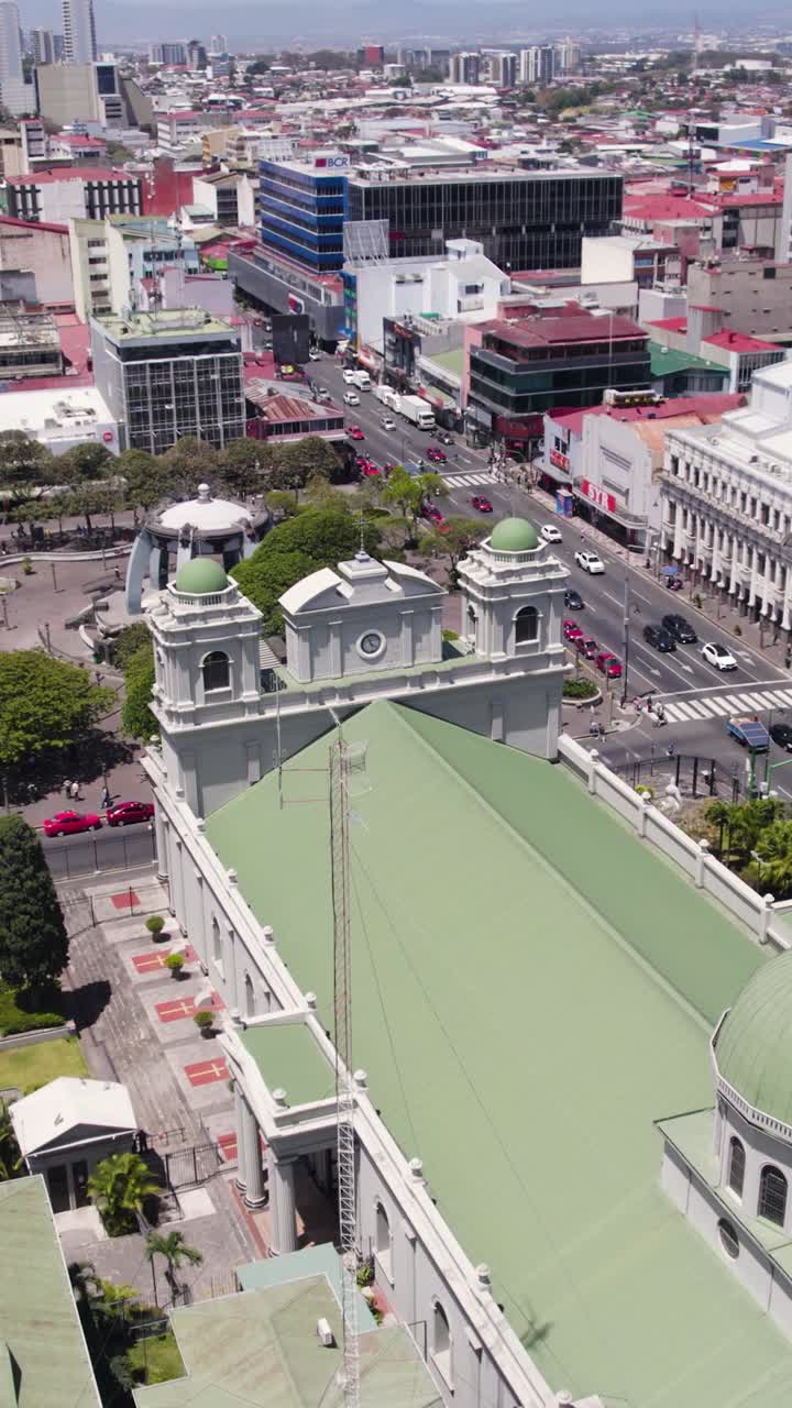 A beautiful aerial perspective of the San Jose Metropolitan Cathedral and its surroundings. Vertical video