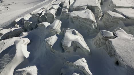 aerial panoramic, glacier makes relief on the snow plain, winter landscape in the alps