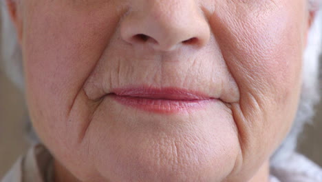 Closeup-of-smiling-senior-woman's-lips