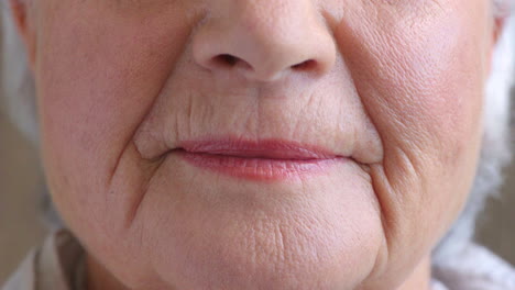 closeup of smiling senior woman's lips