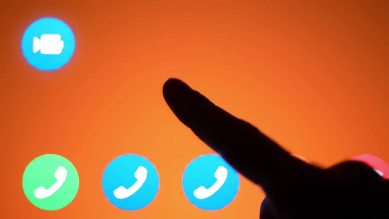 A Close-Up of a Finger Hovering Over Phone Call and Video Call Icons Against a Striking Orange Background, Suggesting Communication Choice and Digital Interaction