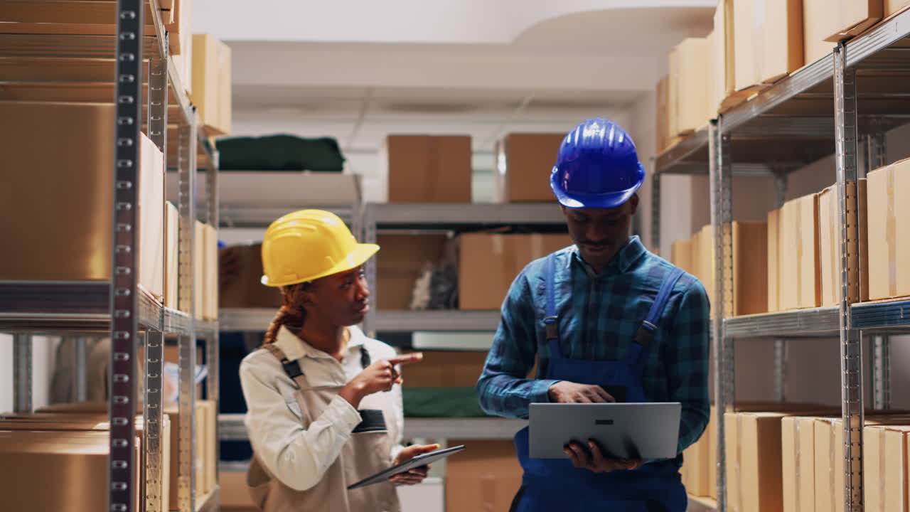 Warehouse employees working with boxes and inventory