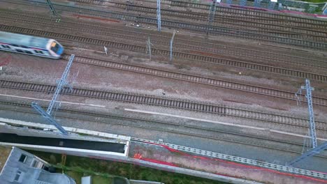 train running on railway. aerial top-down sideways