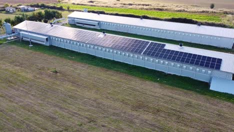 aerial shot of solar panels on a roof of a building generating electric energy