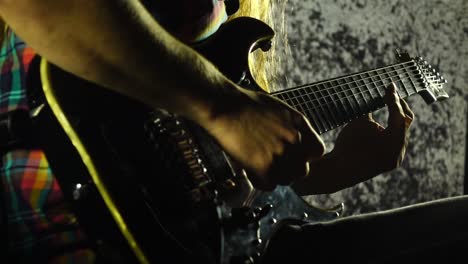 guitar being played by rock musician