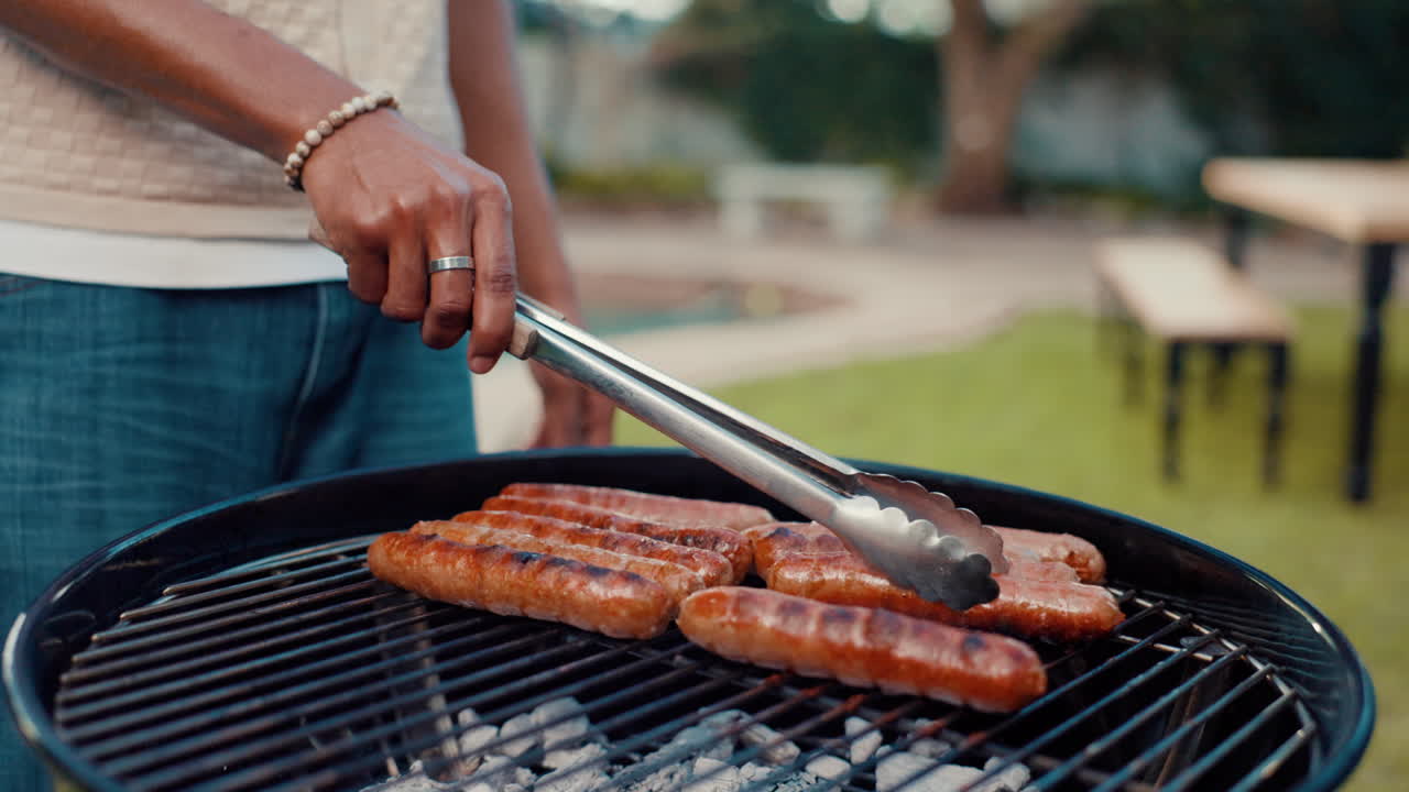 Sausages grilling in the garden