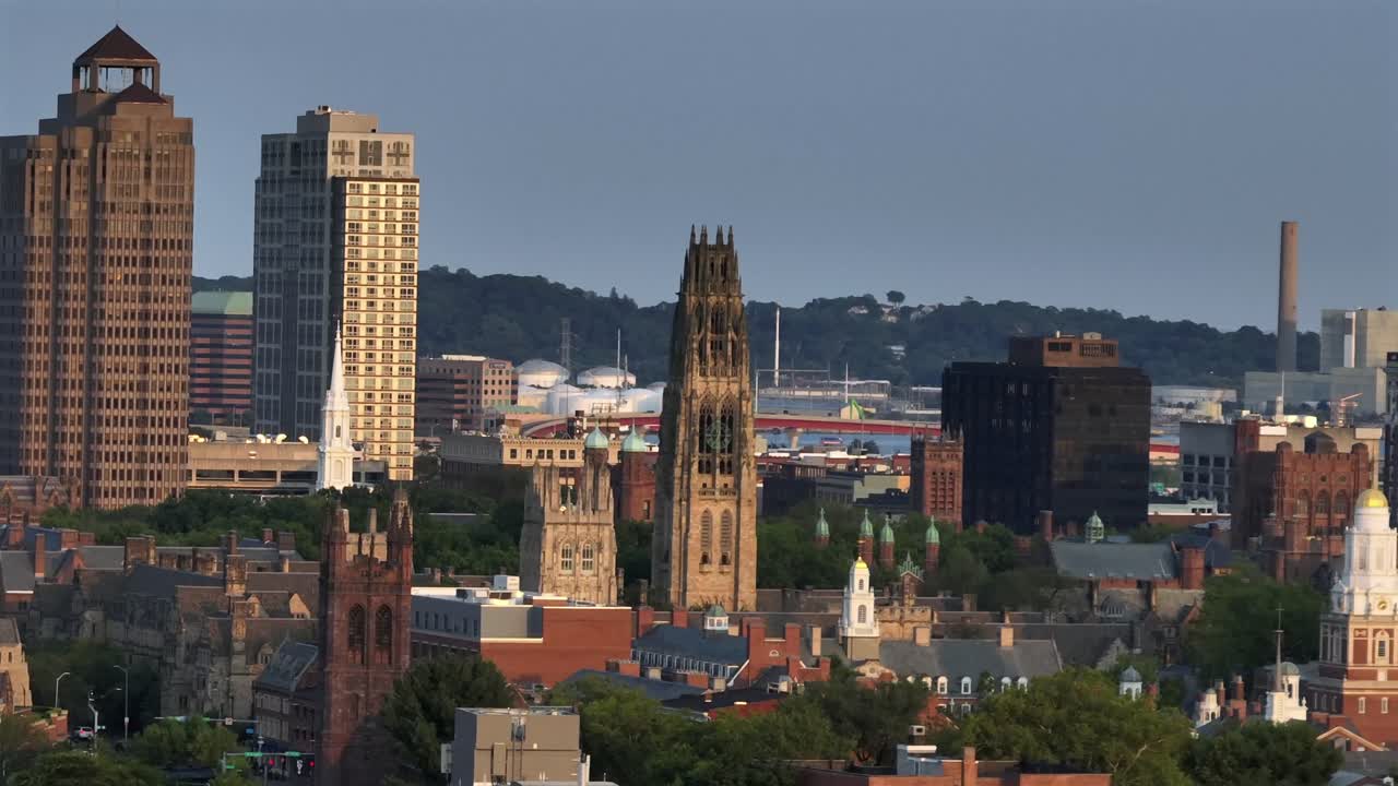 Historic cathedral and harkness tower in New Haven, Connecticut. Aerial zoom Wide shot. Old University and downtown buildings in center. Sunrise time on peaceful morning in u.s