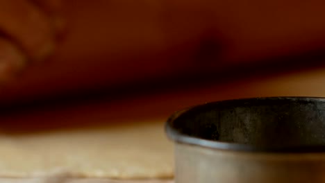 close up of a pasta stamp on a floured table