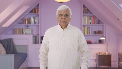 Angry-Indian-old-man-looking-at-the-camera