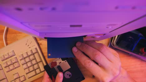 using diskette for old computer. music recorder, playing retro computer games. vintage device for office, obsolete technology. . high quality 4k footage