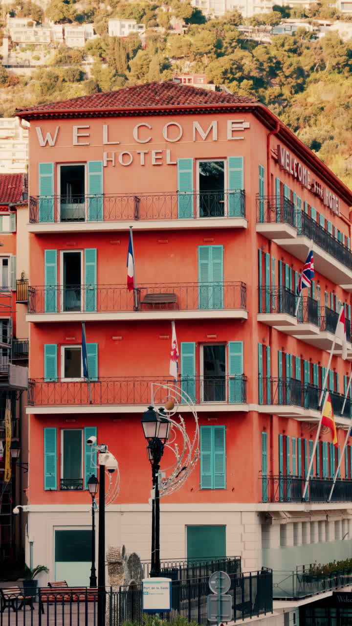 Villefranche Sur Mer, France - December 8, 2024: Front view of the Welcome Hotel in a seaside town on the French Riviera. Vertical