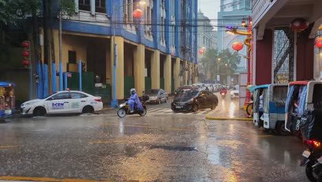 rainy day in chinatown: city street scene with heavy traffic