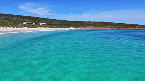 Crystal-clear-water-at-Smiths-Beach-in-Margaret-River,-Western-Australia---drone-flying-low-over-water