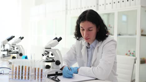 scientist conducting research with a microscope in a laboratory