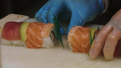 preparing sushi at a sushi bar and take away