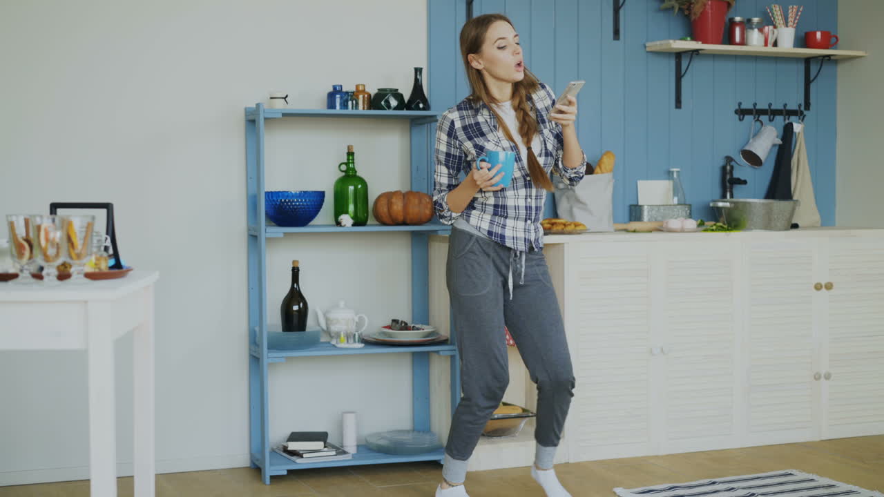 Woman enjoying a morning in her kitchen