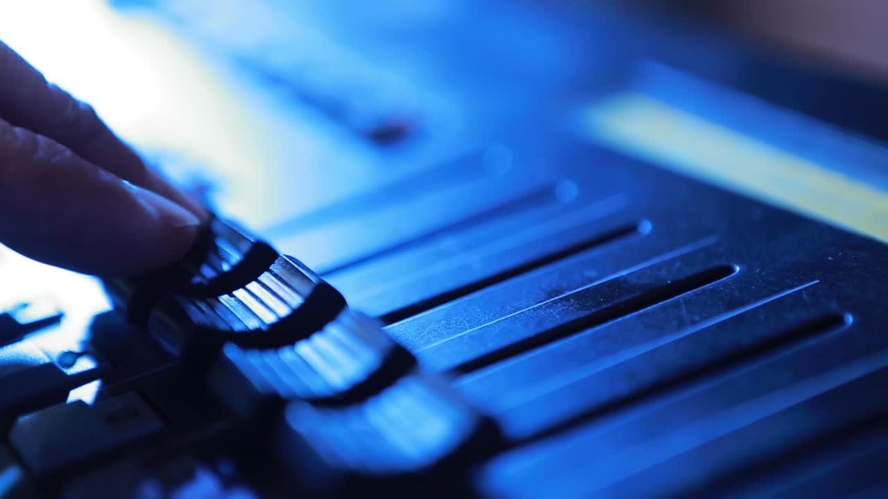 Mixing Desk In A Recording Studio. Volume slide audio mixer in the recording studio