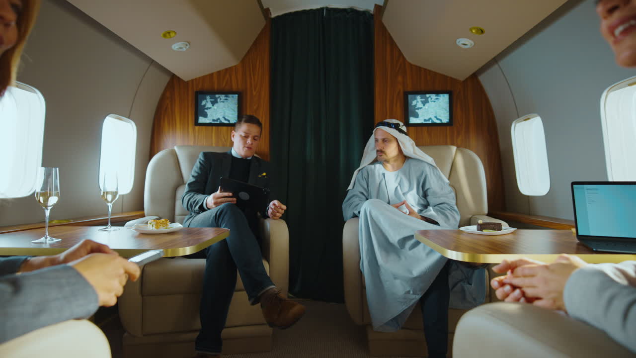 Businessmen Negotiating in a Private Jet