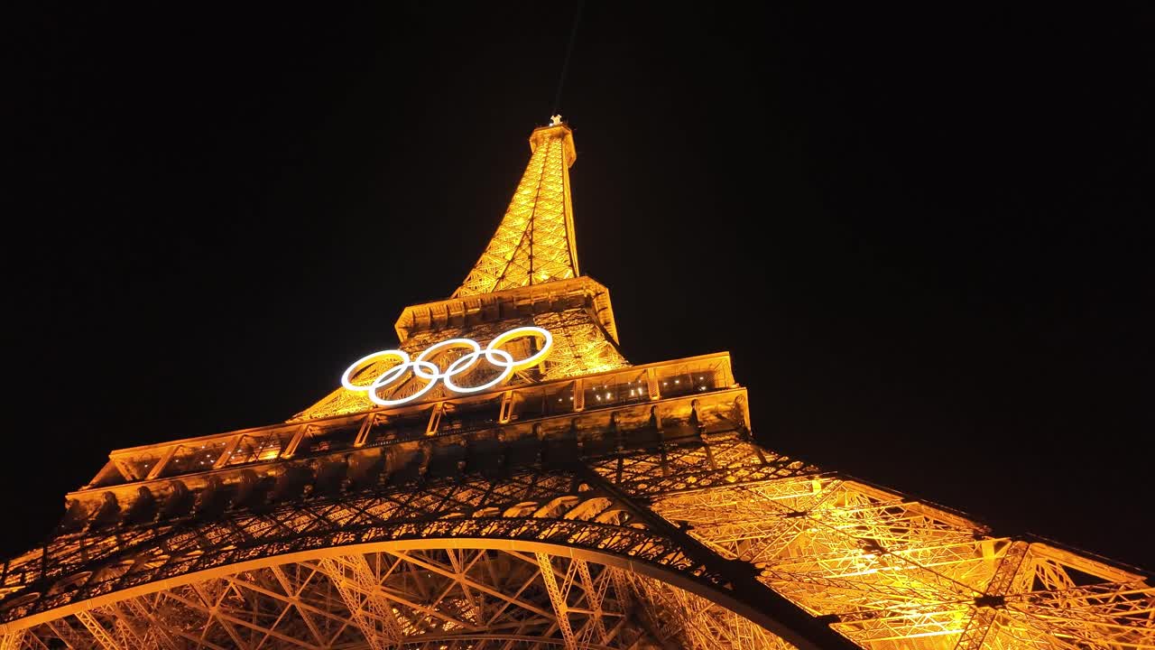 Eiffel Tower illuminated at night with Olympic rings