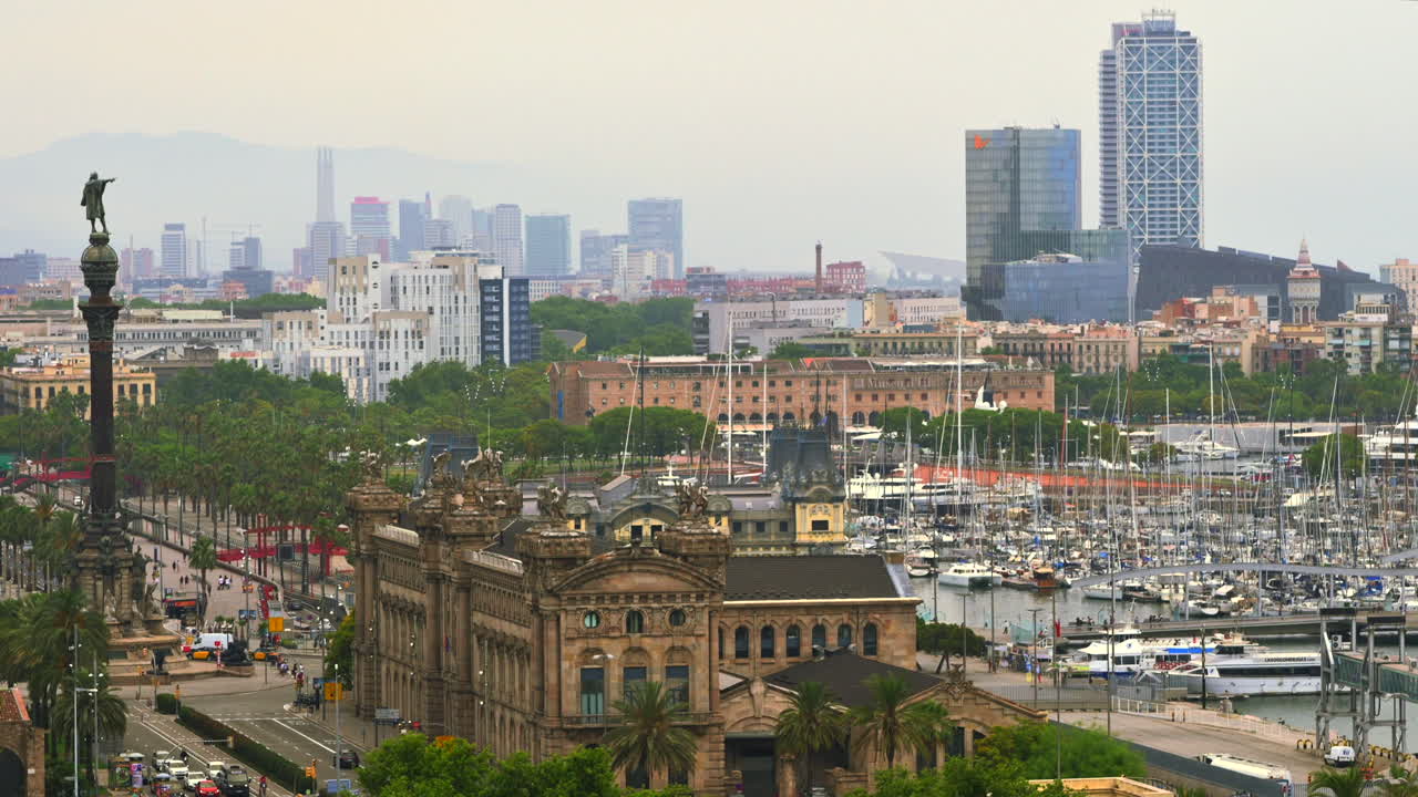 Aerial drone view of the Port Vell, the Columbus Monument and the Junta d'Obres del Port building in Barcelona, Spain