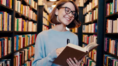 woman reading and studying in a library