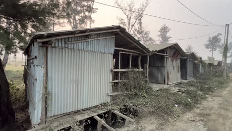 cinematic profile view of multiple aluminum abandoned huts in a row during evening in kolkata, india