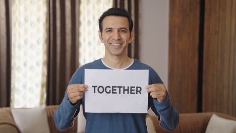 Happy Indian man holding TOGETHER banner